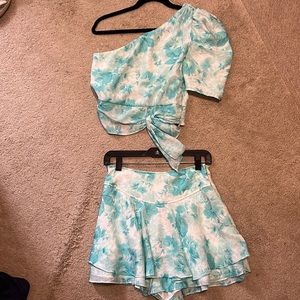 Two piece set: one shoulder floral blouse medium and ruffled floral skirt medium